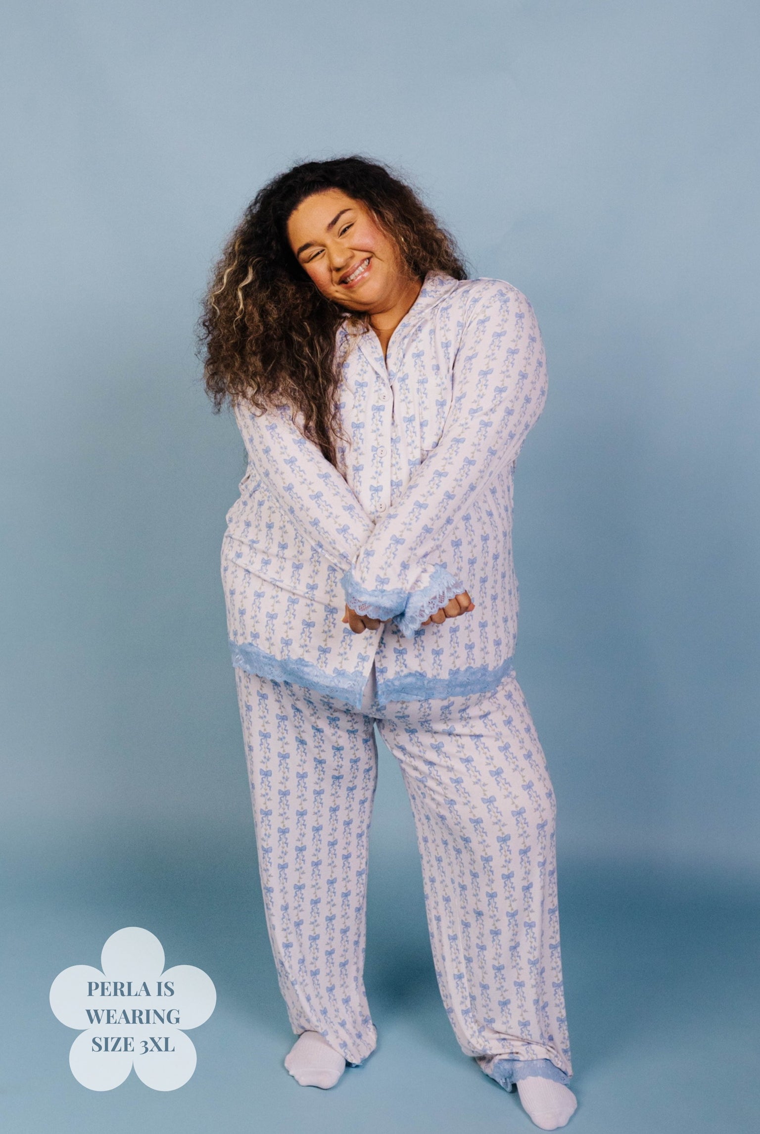 Woman wearing a patterned pajama set against a plain background size 3xl
