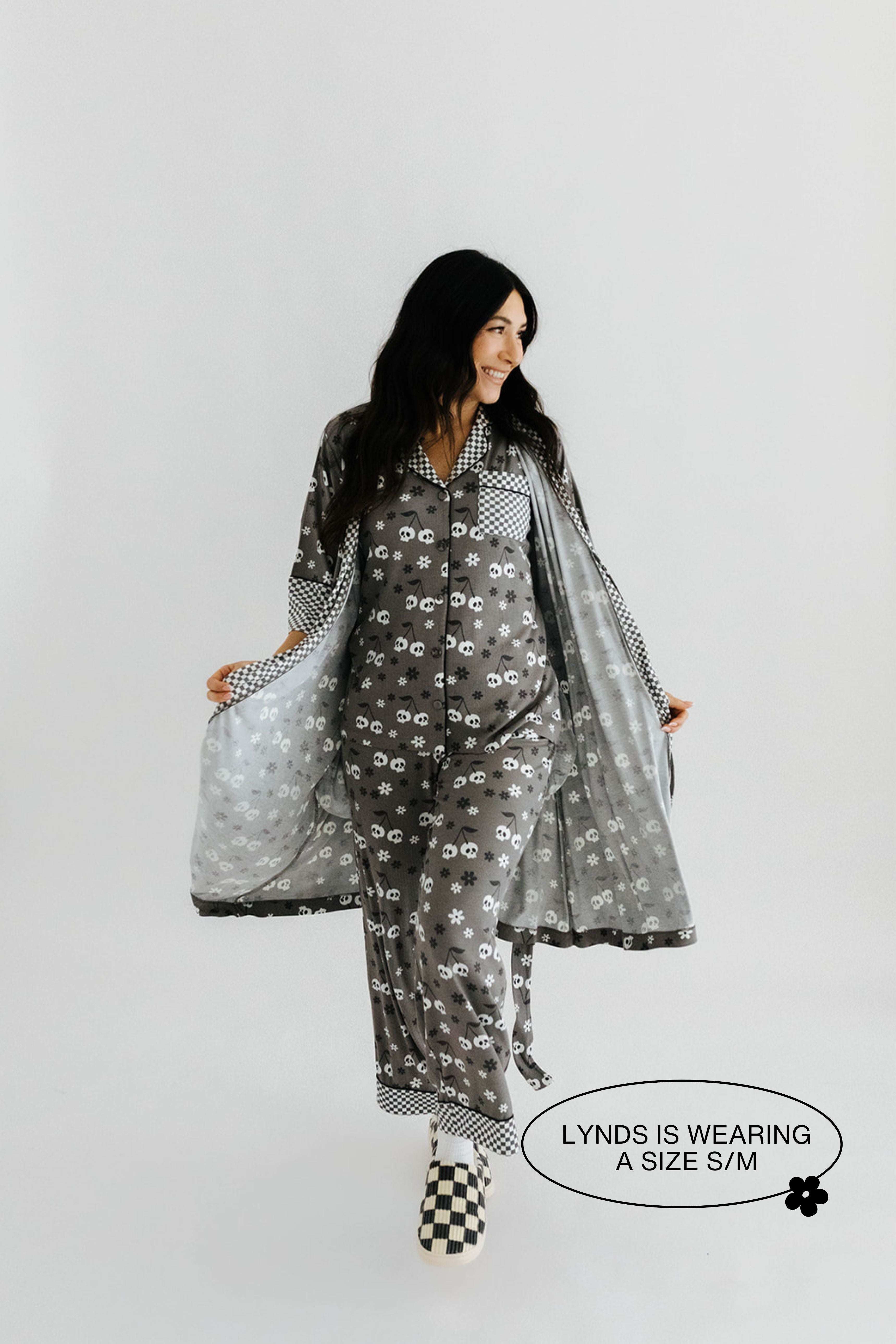 model lynds wearing the size small in the skelly pajamas and skelly ribbed robe