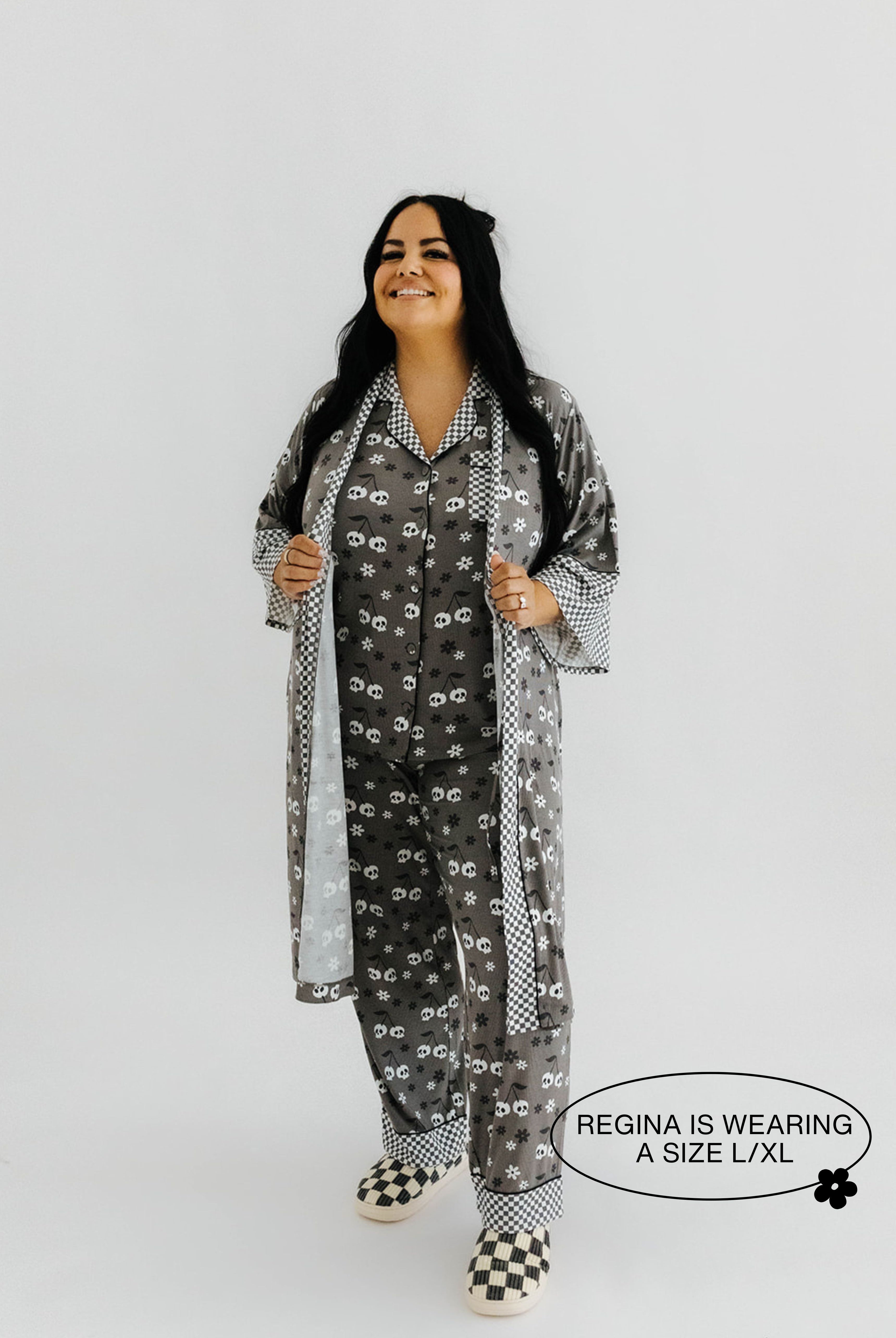 model regina wearing the size extra large in the skeleton pajamas and robe