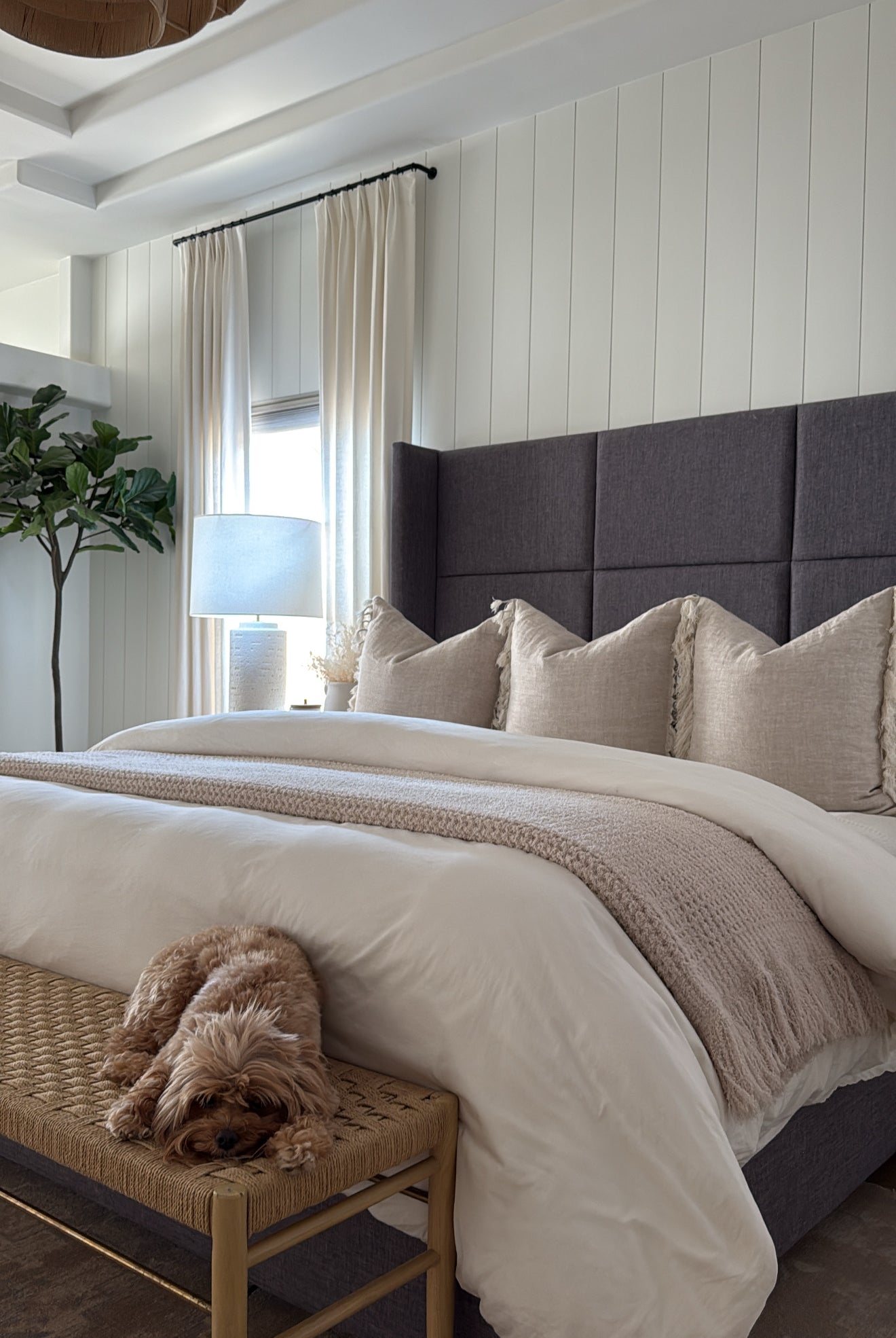 Picture of a bed with the sand waffle blanket styled on it