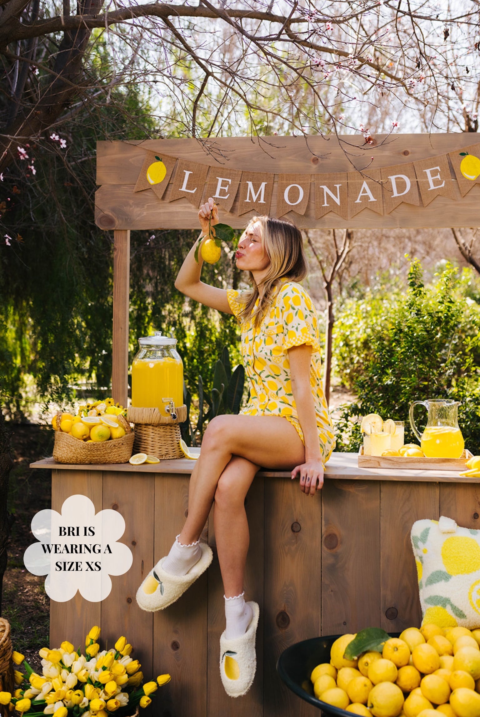 Bri posing in the XS pjs while sitting on the lemonade stand