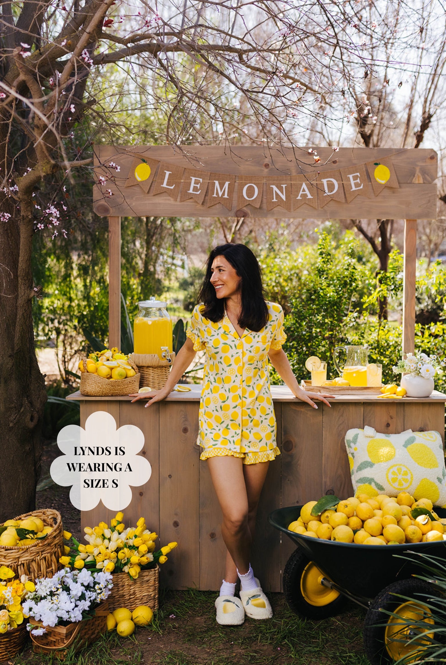 Lynds posting in the small pjs in front of the lemonade stand