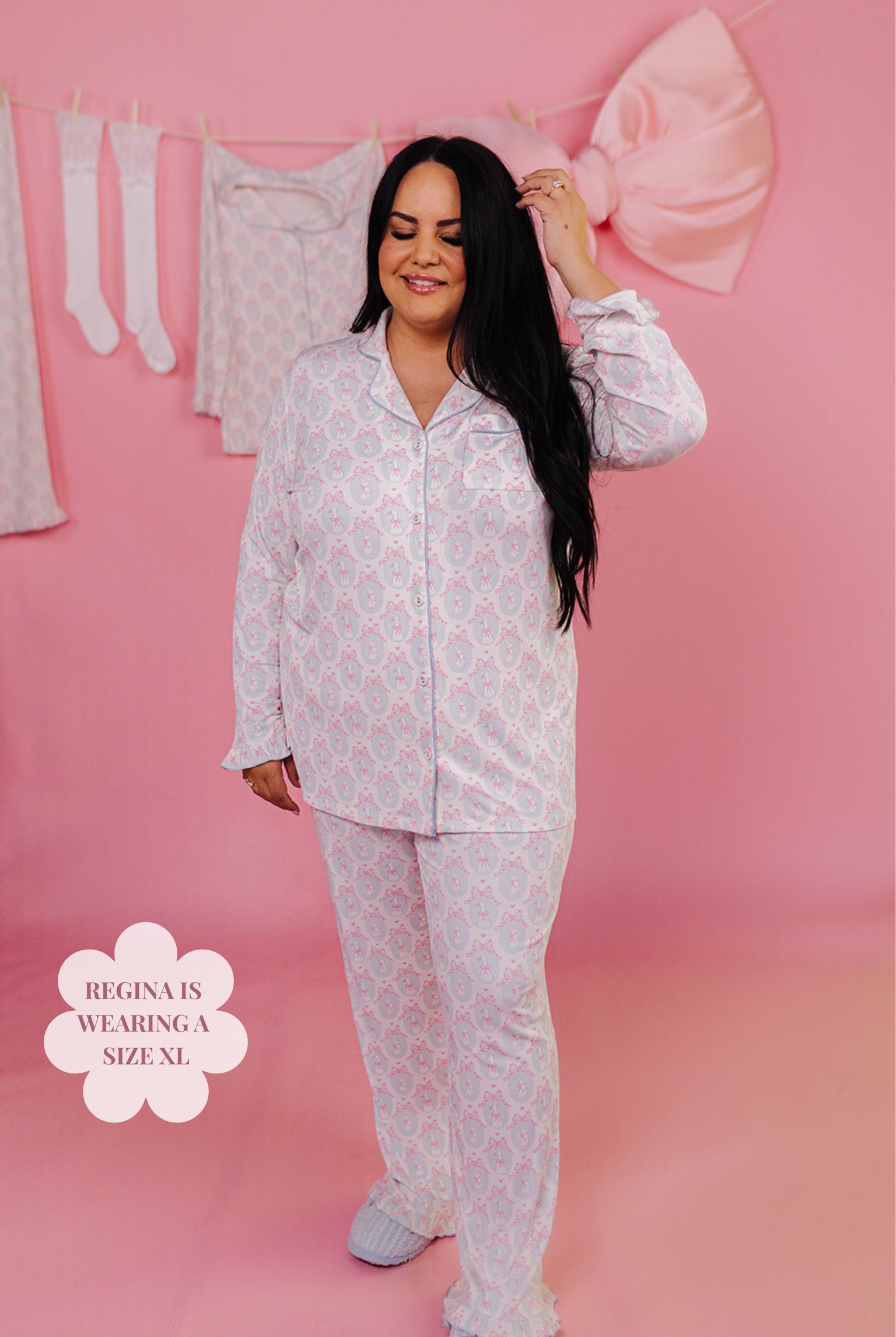 Woman wearing a white pajama set on a pink background with text indicating size XL.