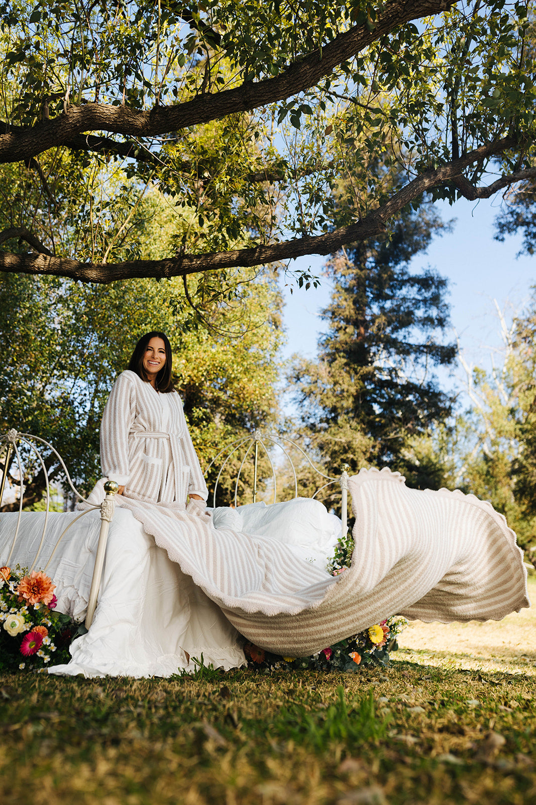 Krista showing the larger size of the blanket