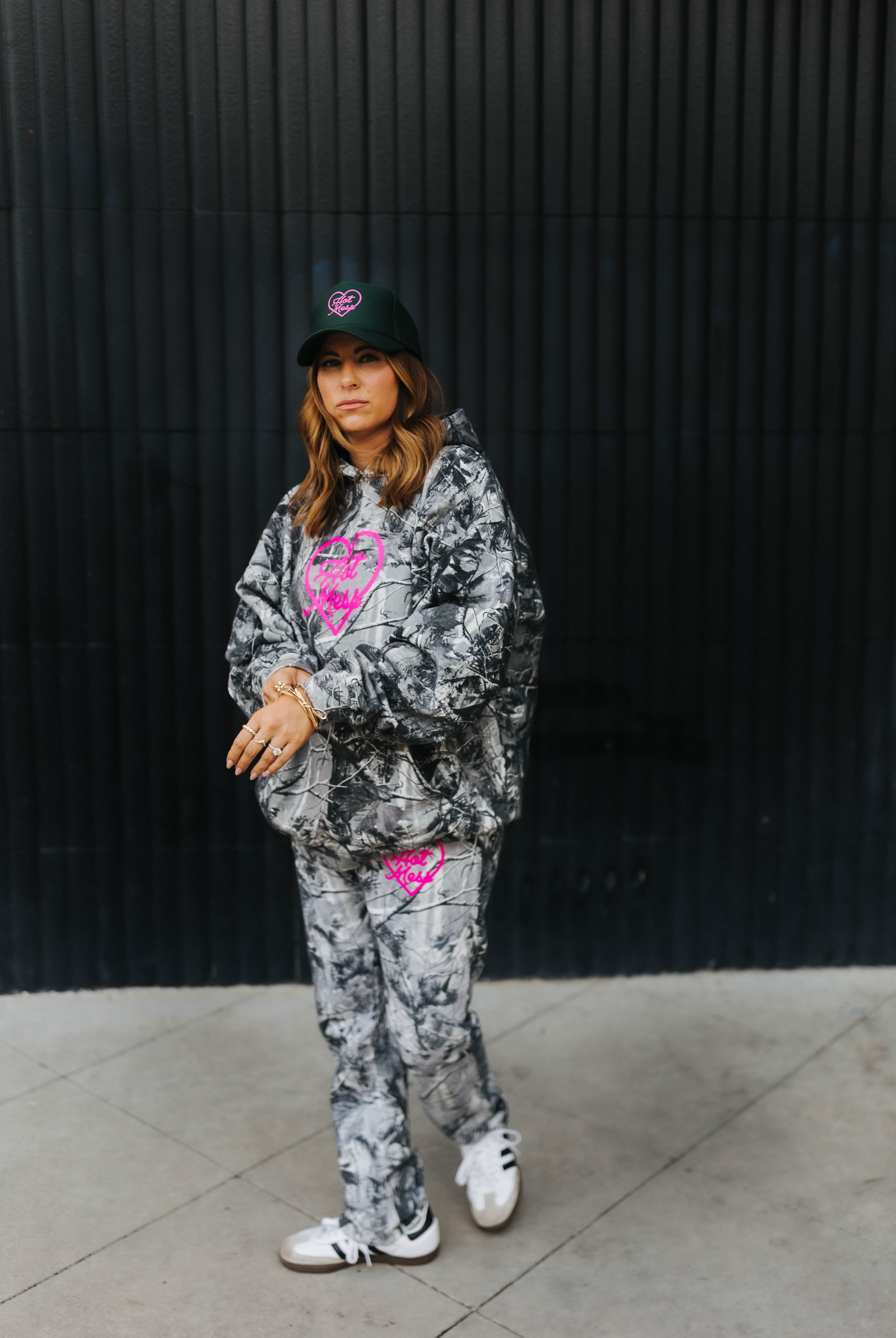model looking at camera wearing hot mess at heart camo set with hot mess at heart hat