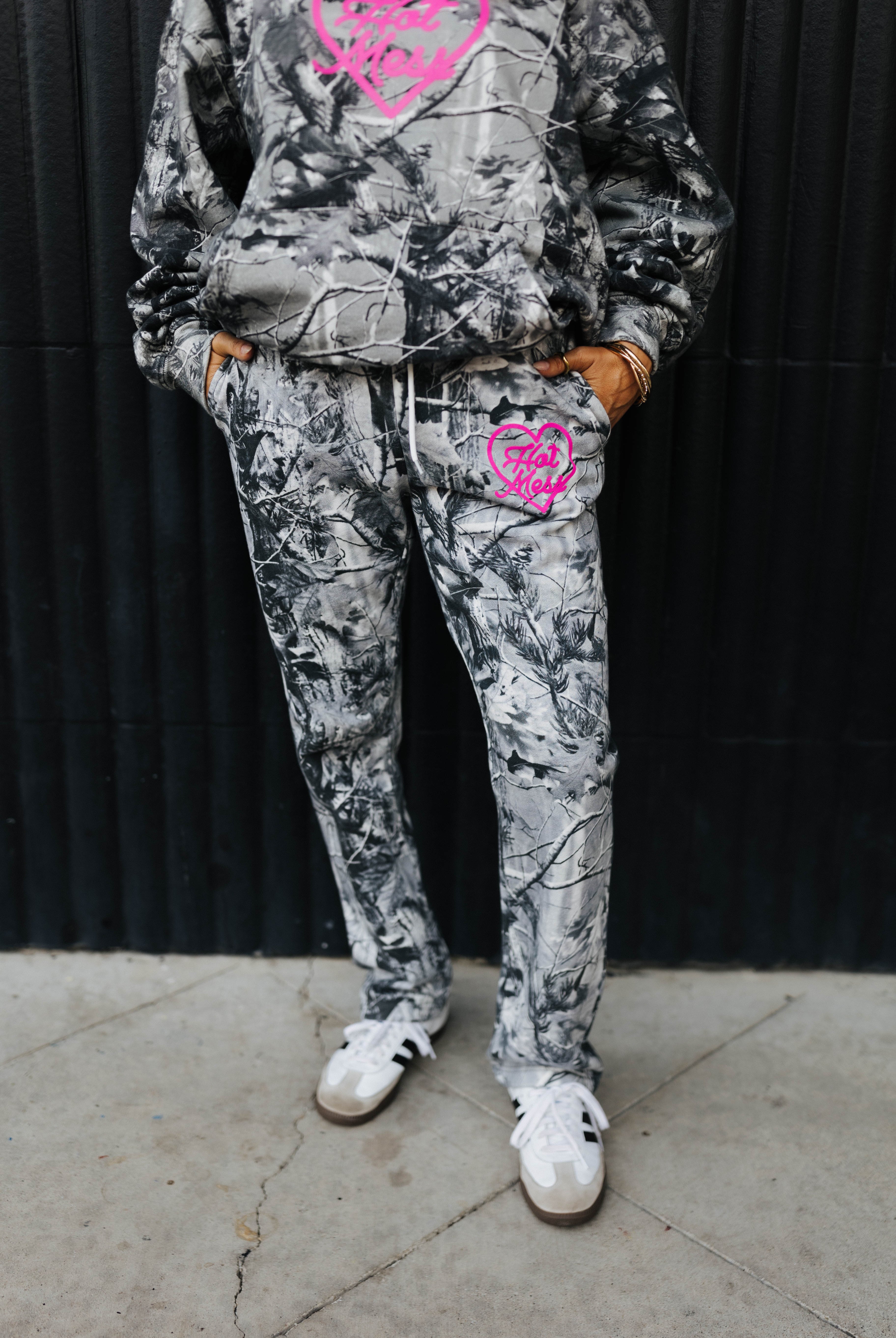 model wearing hot mess at heart camo set showing the camo sweatpants with pink text and pink graphic