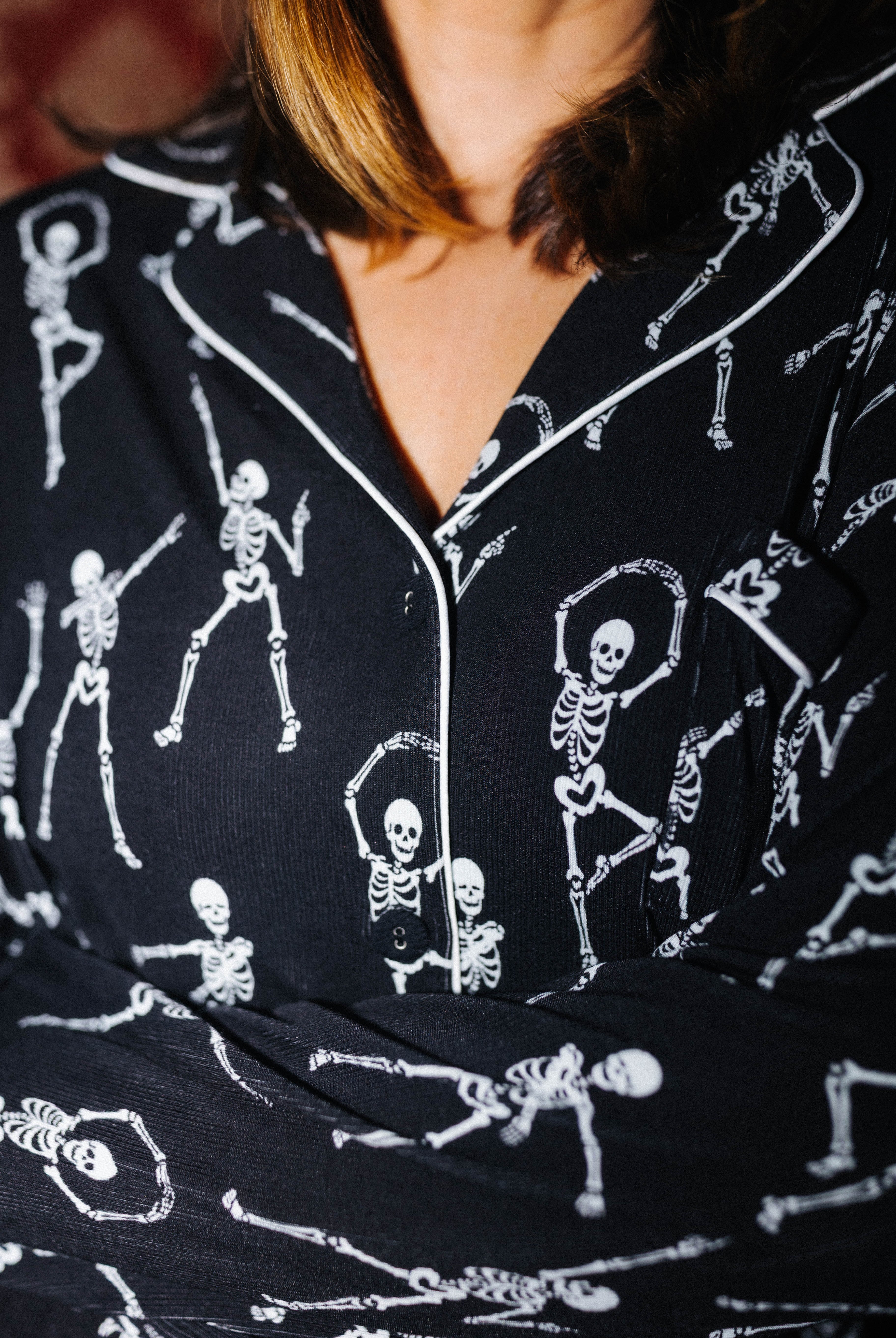 Close view of the collar and skeleton print on adult Skelly pajamas
