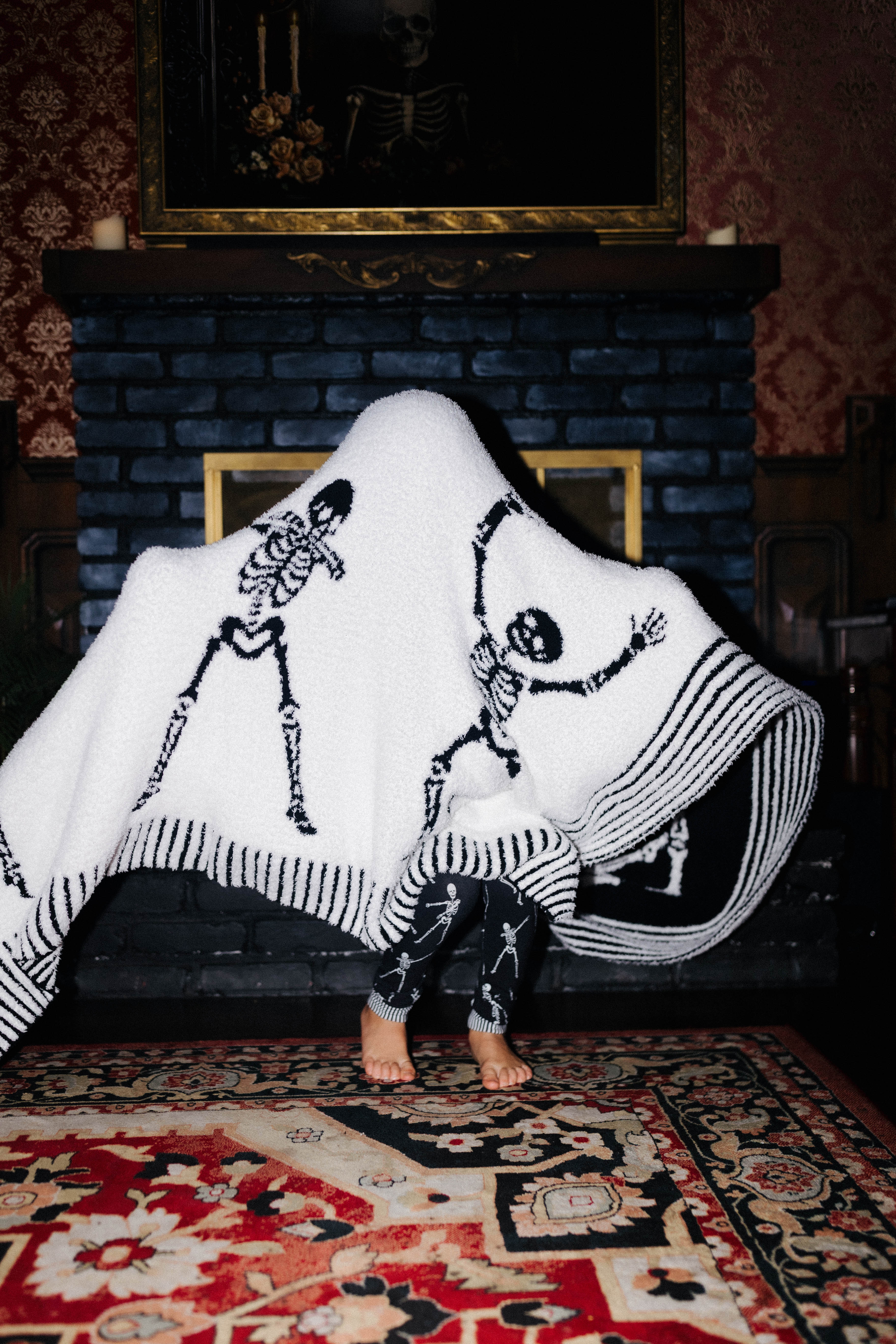 Skelly Blanket 60x80 shown in a second full length view