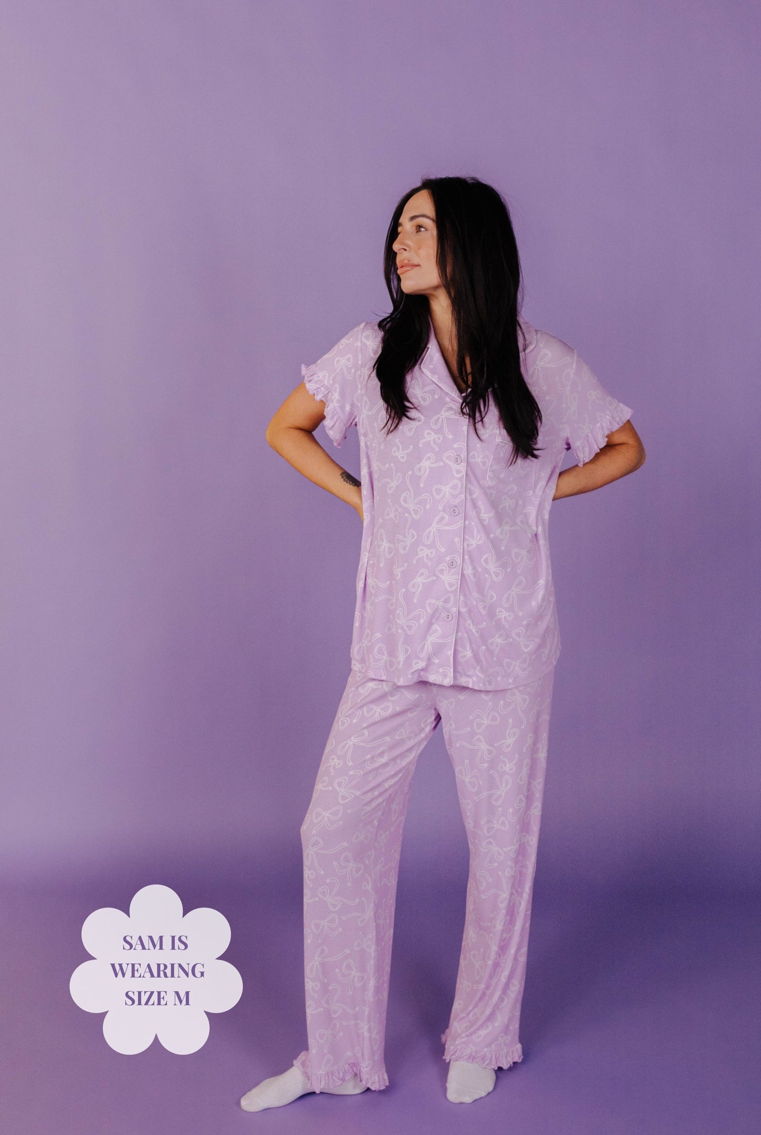 Sam in purple pj against a purple background
