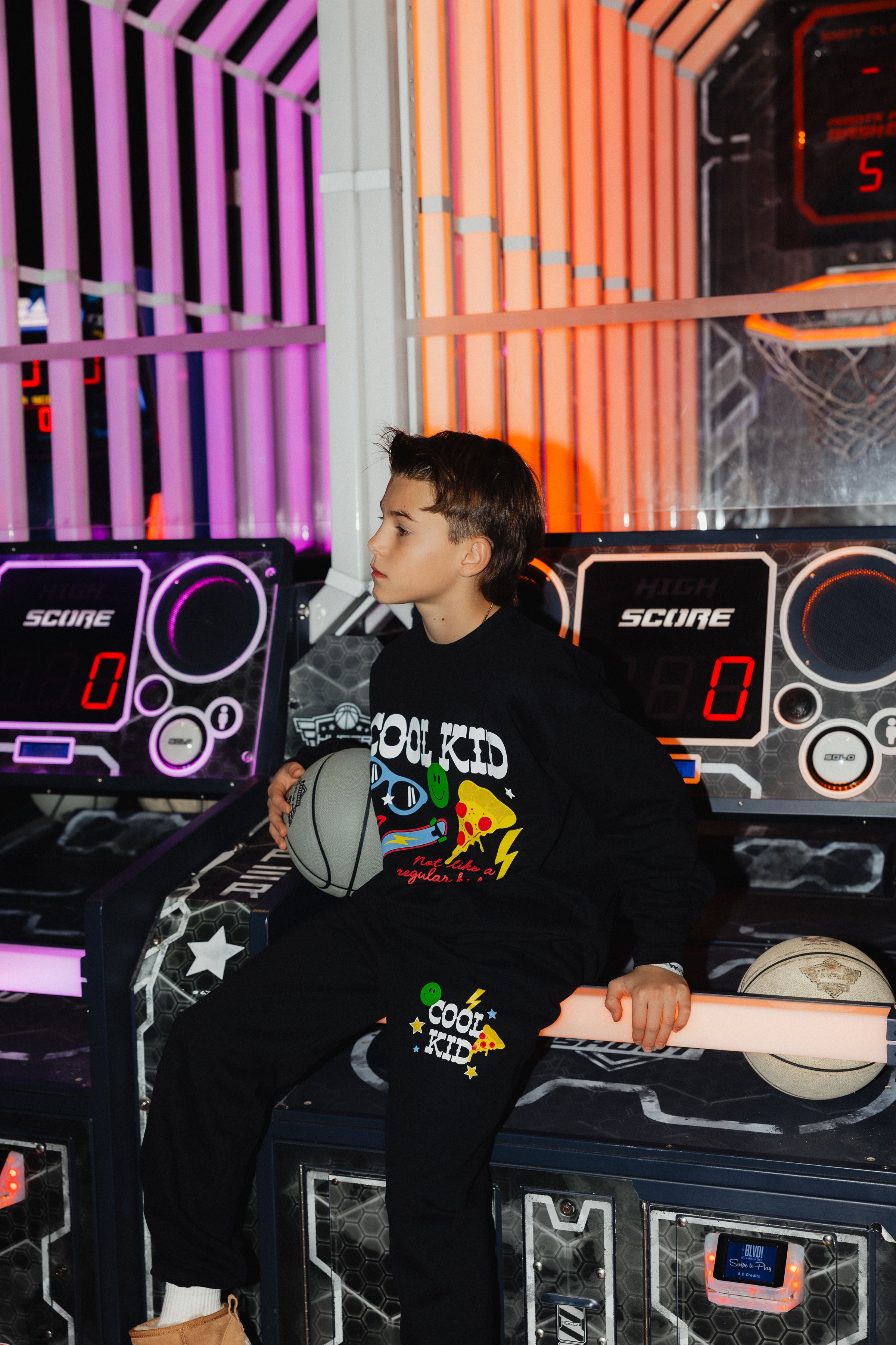 Another detail shot of Boston holding the basketball showing off the set