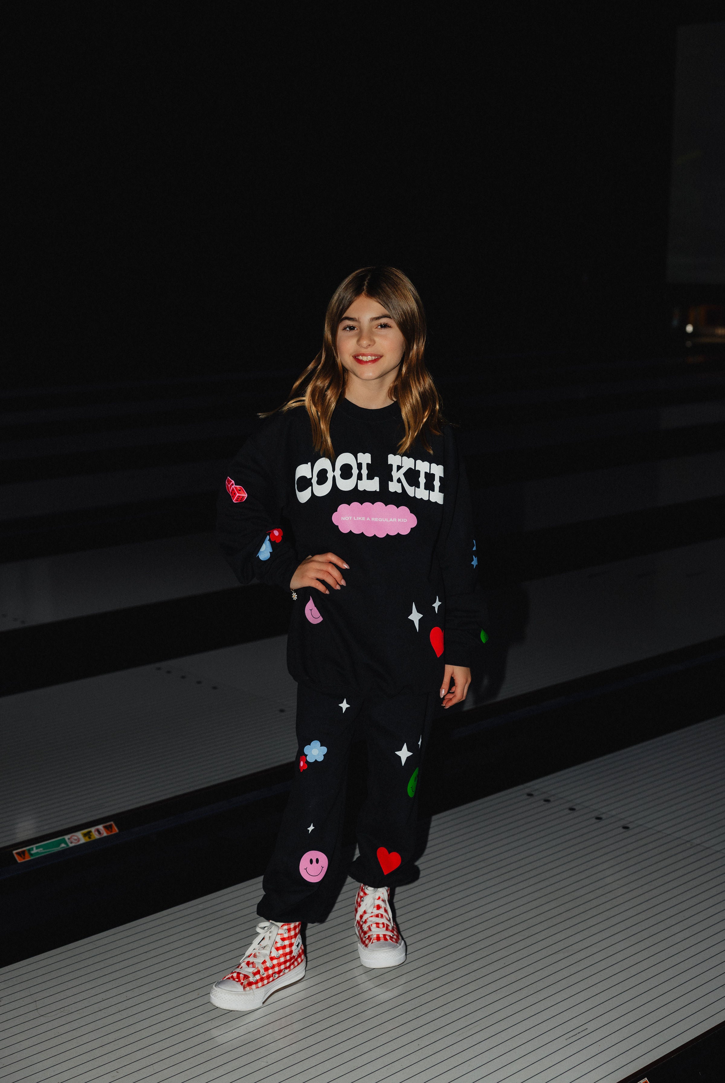 Full pic of Kolly in the icon sweatpants and sweatshirt.