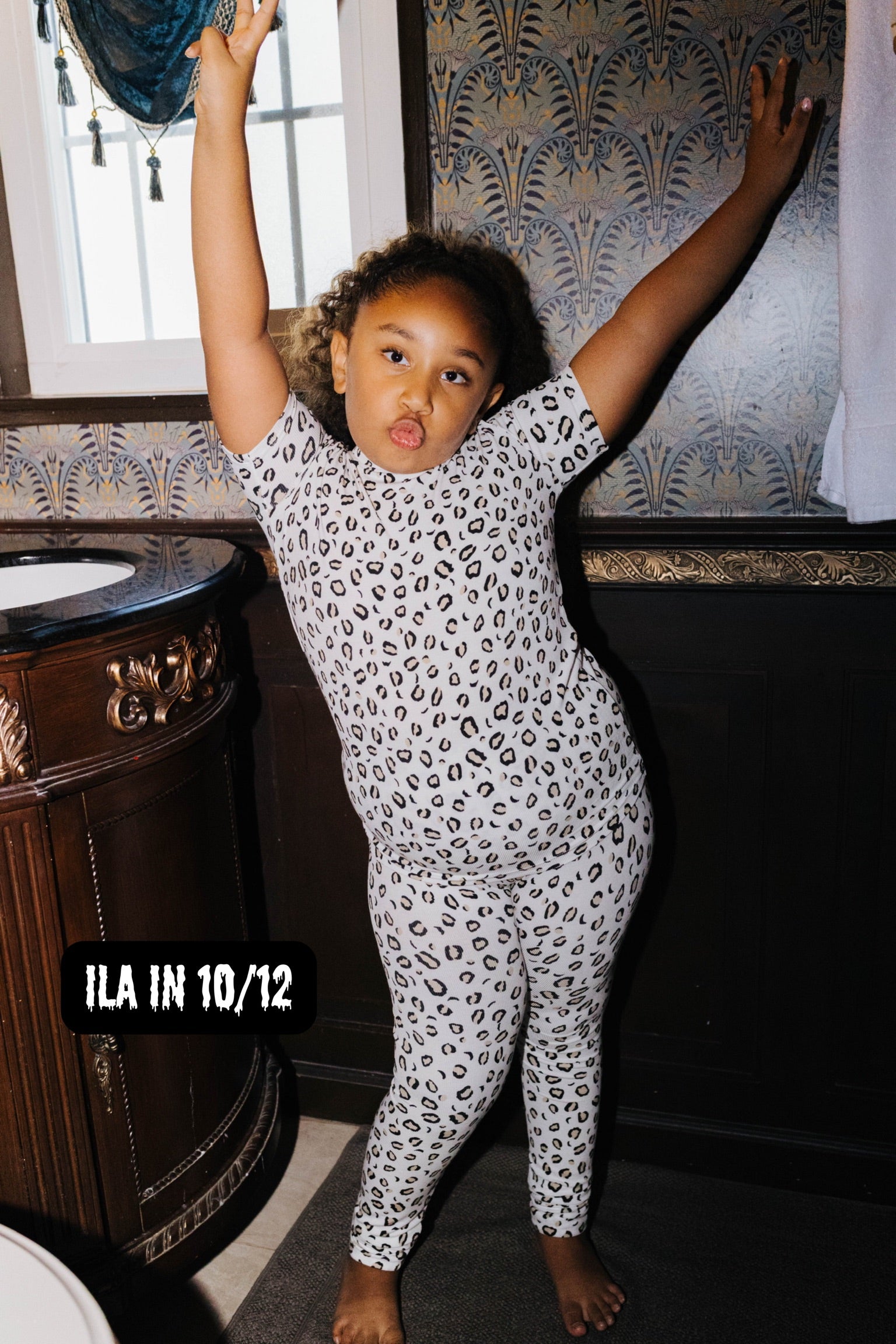 Ila wearing size 10/12 in the Kid Leopard Pajama Set