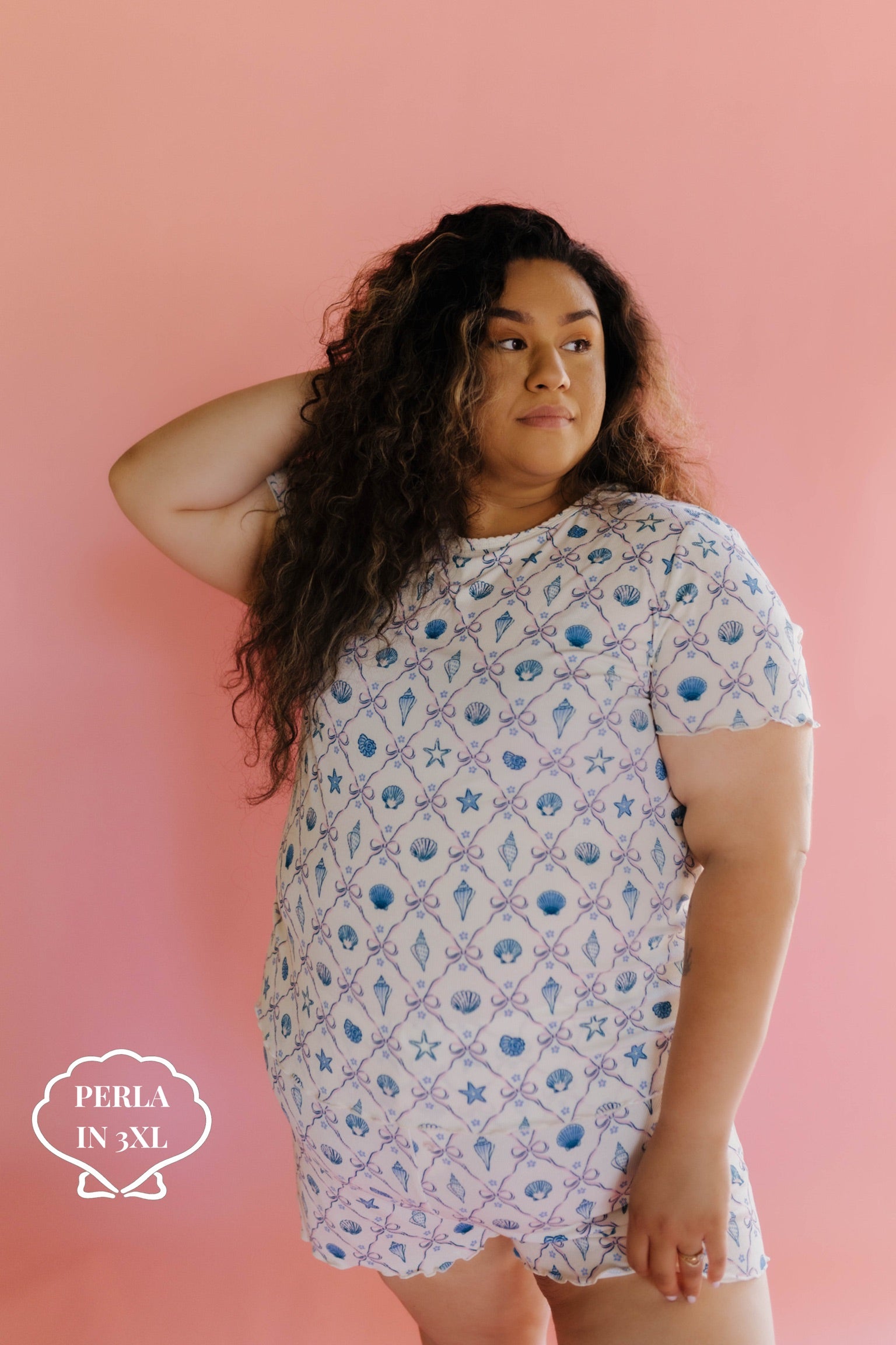 Woman wearing a shell pj set in size 3xl