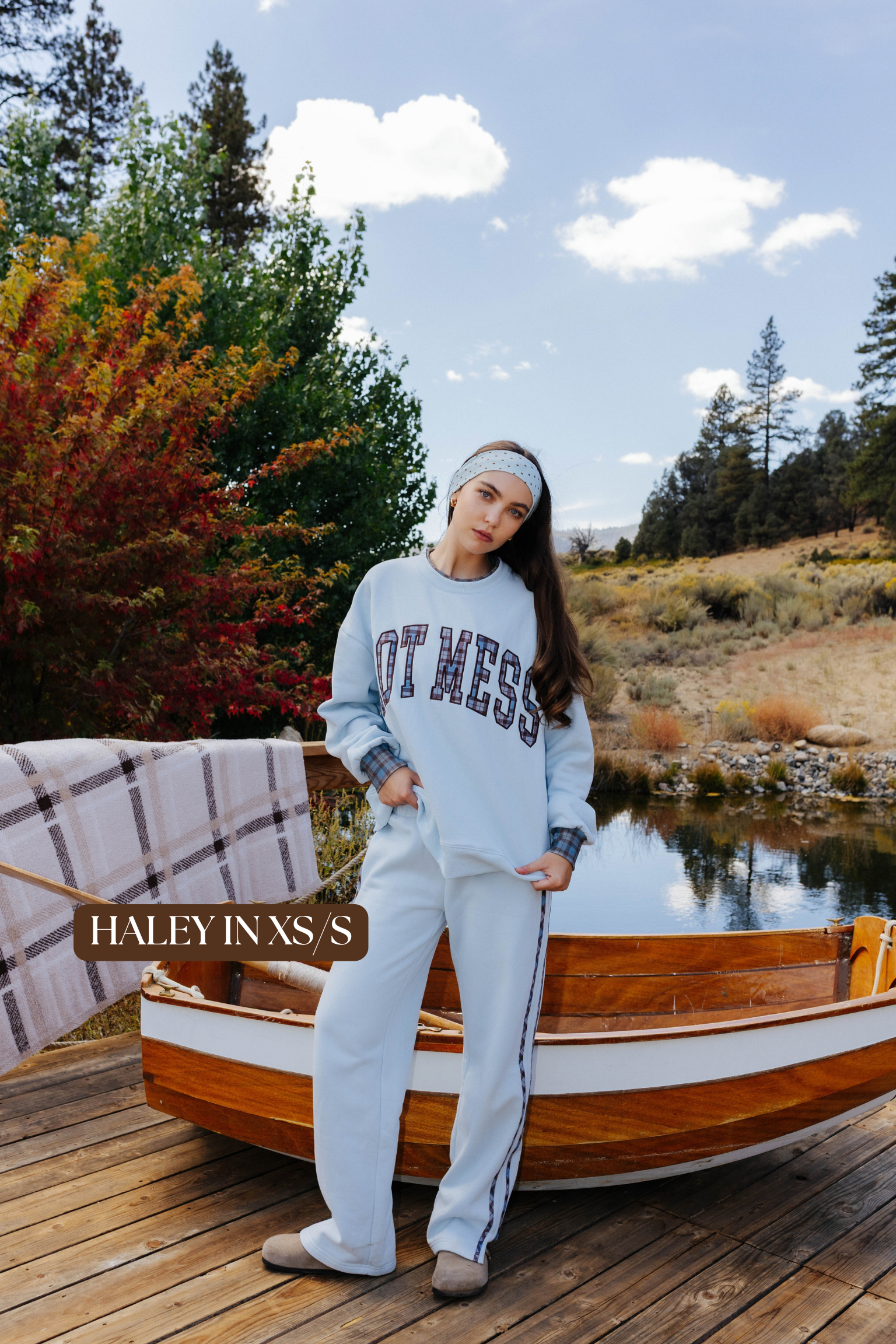 Sizing photo: Haley in XS/S wearing light blue Hot Mess sweatshirt and matching sweatpants.