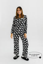 model bri wearing a size xs of the ghost pajamas 