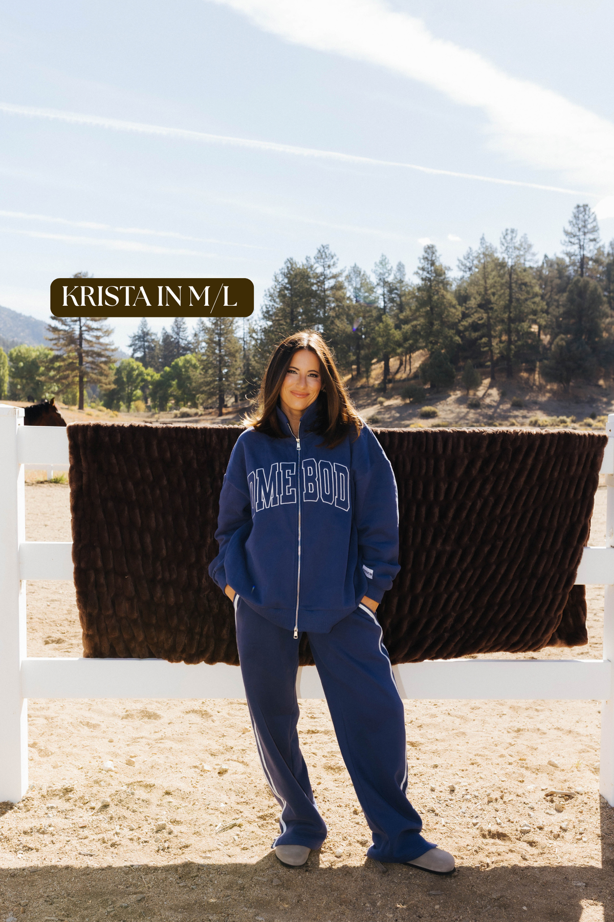 Sizing photo: Krista in M/L wearing blue Homebody sweatshirt and sweatpants.