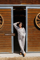 Sizing photo: Krista in L wearing brown and cream striped pajama set.