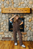 Sizing photo: Malia in XS wearing brown bow print pajama set.