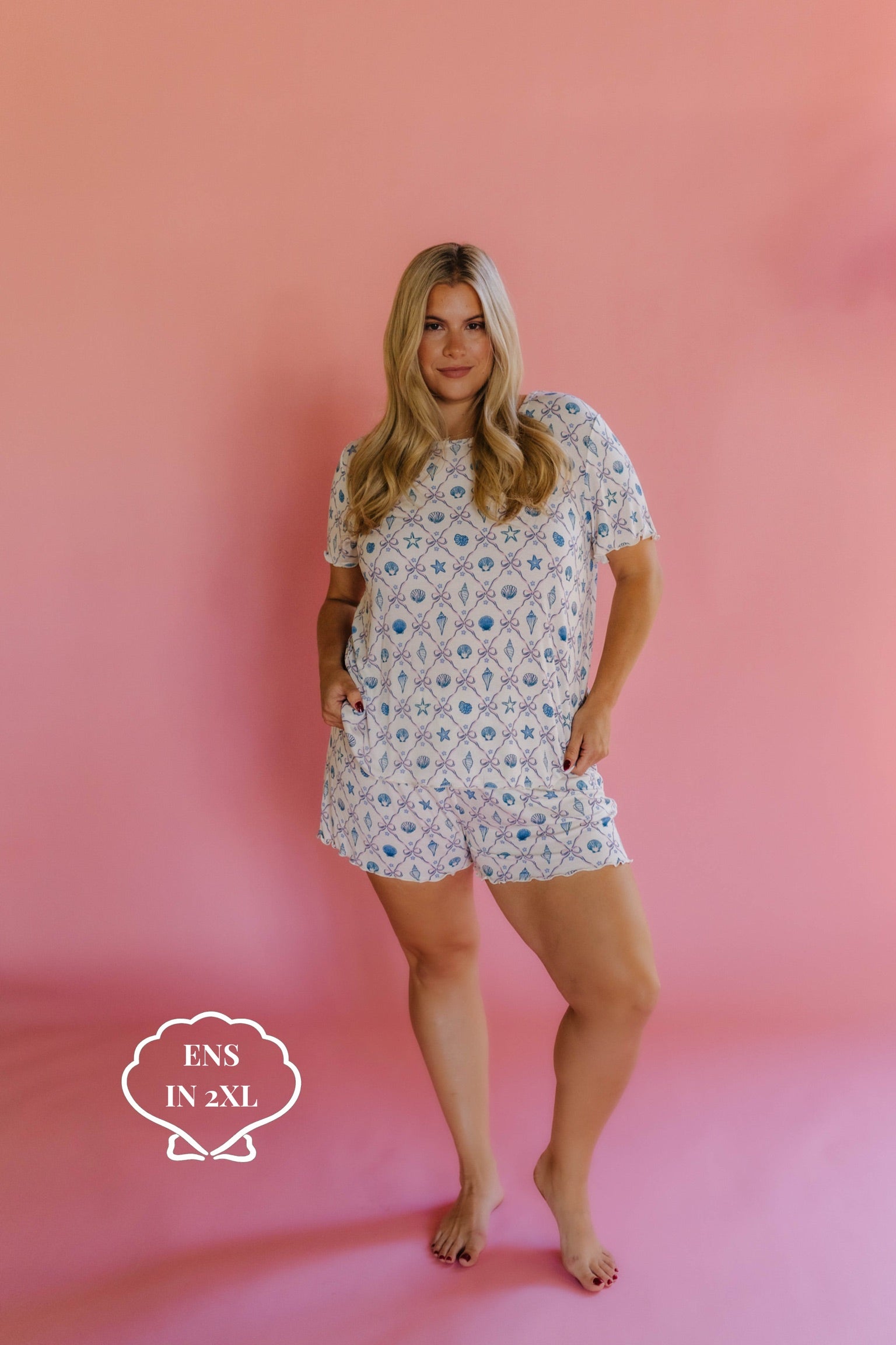 Woman wearing a shell pj set in size 2xl