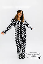 model krista smiling wearing the size large in the ghost pajamas