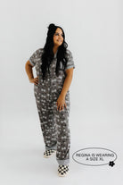 model regina wearing the size extra large in the skeleton pajamas
