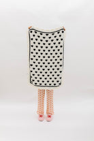 White side of blanket with black hearts