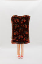 Back of the blanket showing mostly red and black mixed background.