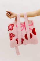 pink quillow with cherry and flower details
