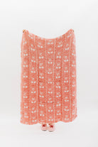 Holding the cherry bow quillow so it shows the full size (back side)