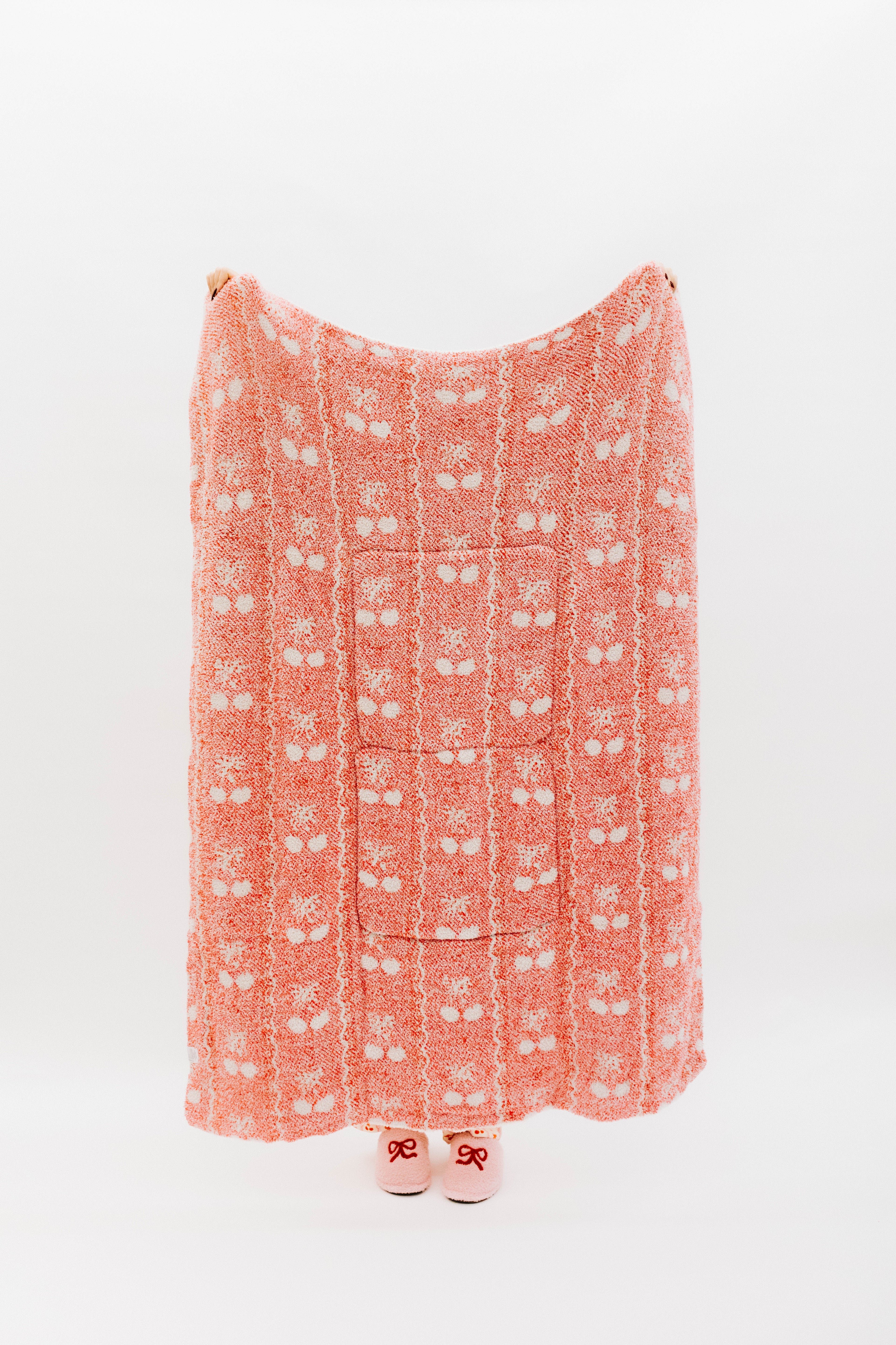 Holding the cherry bow quillow so it shows the full size (back side)