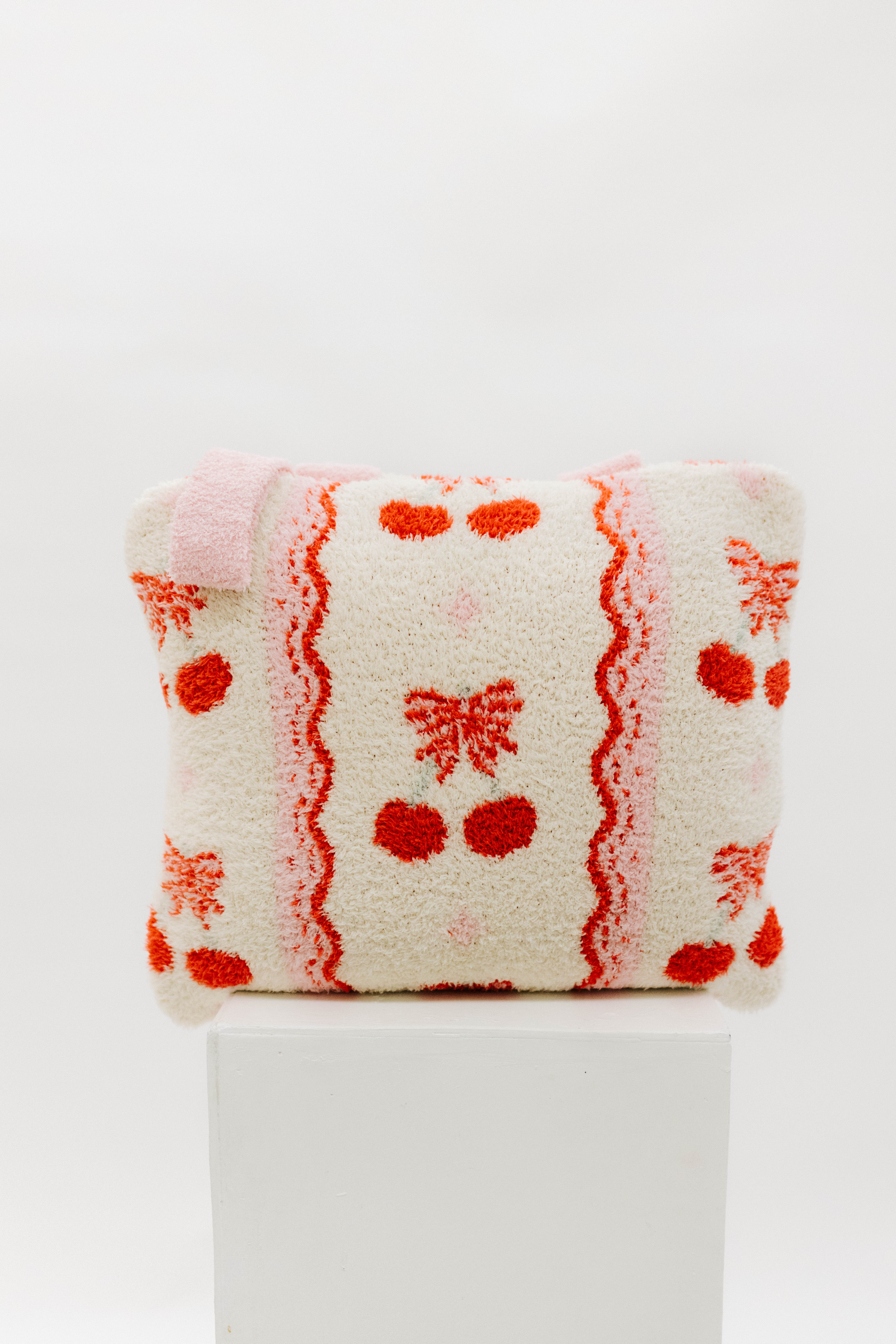 Cherry and bow quillow on pedestal 