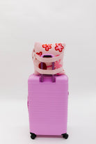 Love you quillow on pink suitcase
