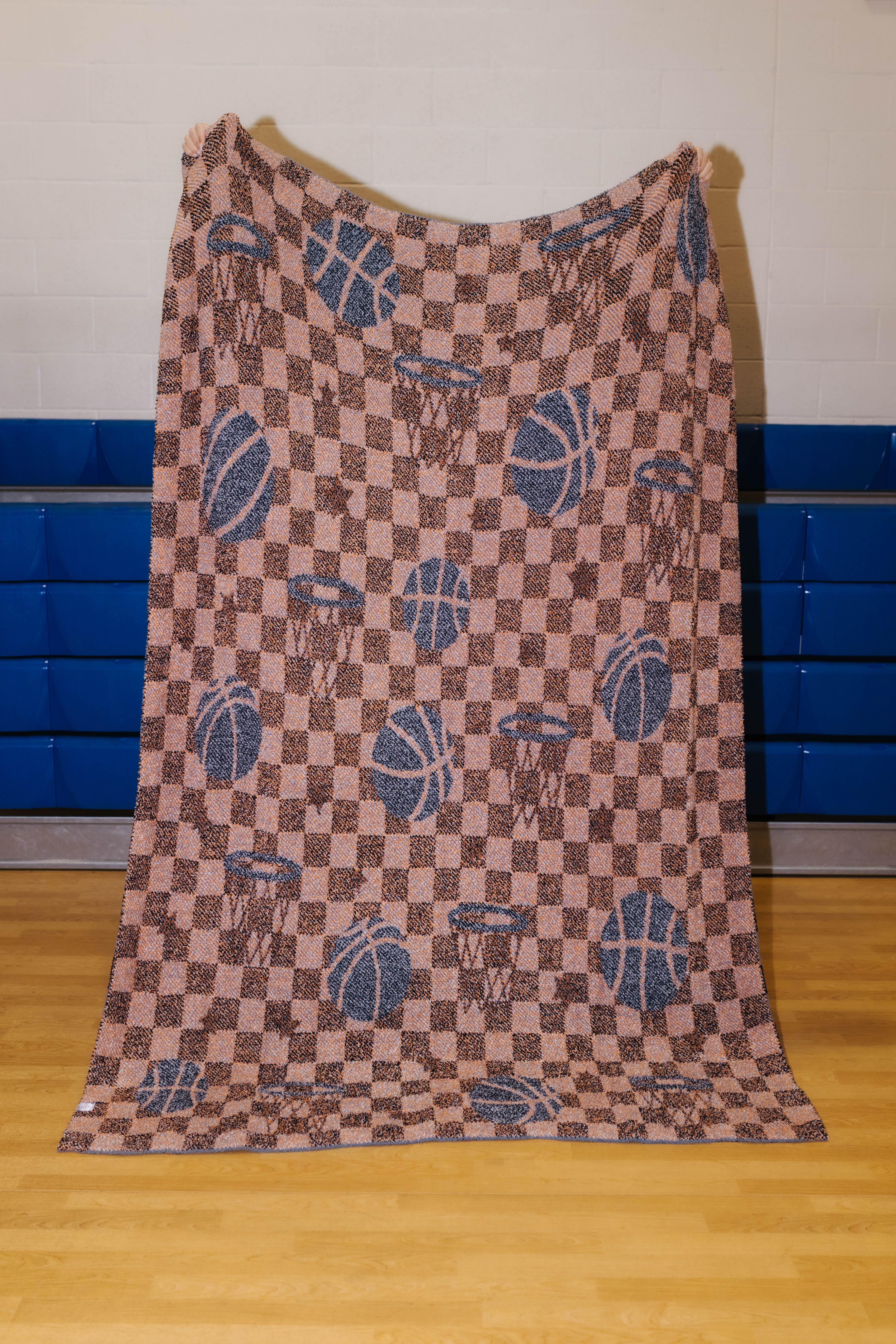 Back of the basketball blanket showing mostly orange/grey pattern