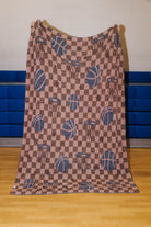 Back of the basketball blanket showing mostly orange/grey pattern