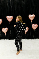 Little girl with the backpack heart quillow on her back 