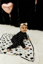 Baby on top of the blanket