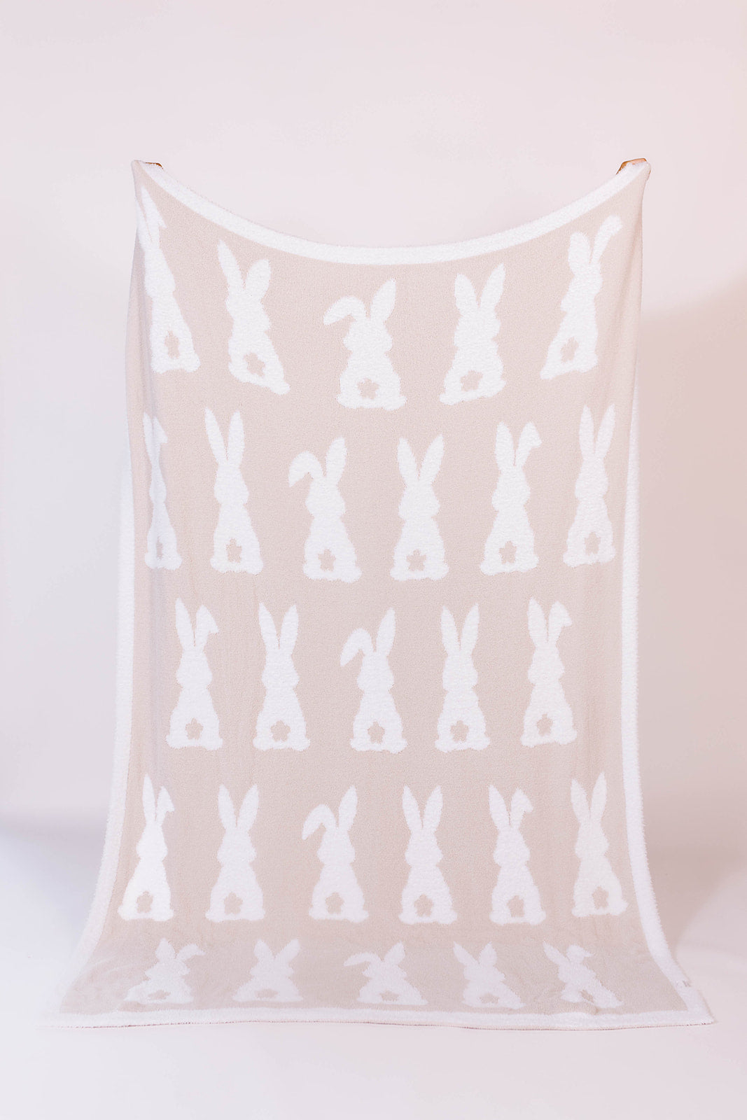 60*80 blanket with white bunny pattern on a sand 
background