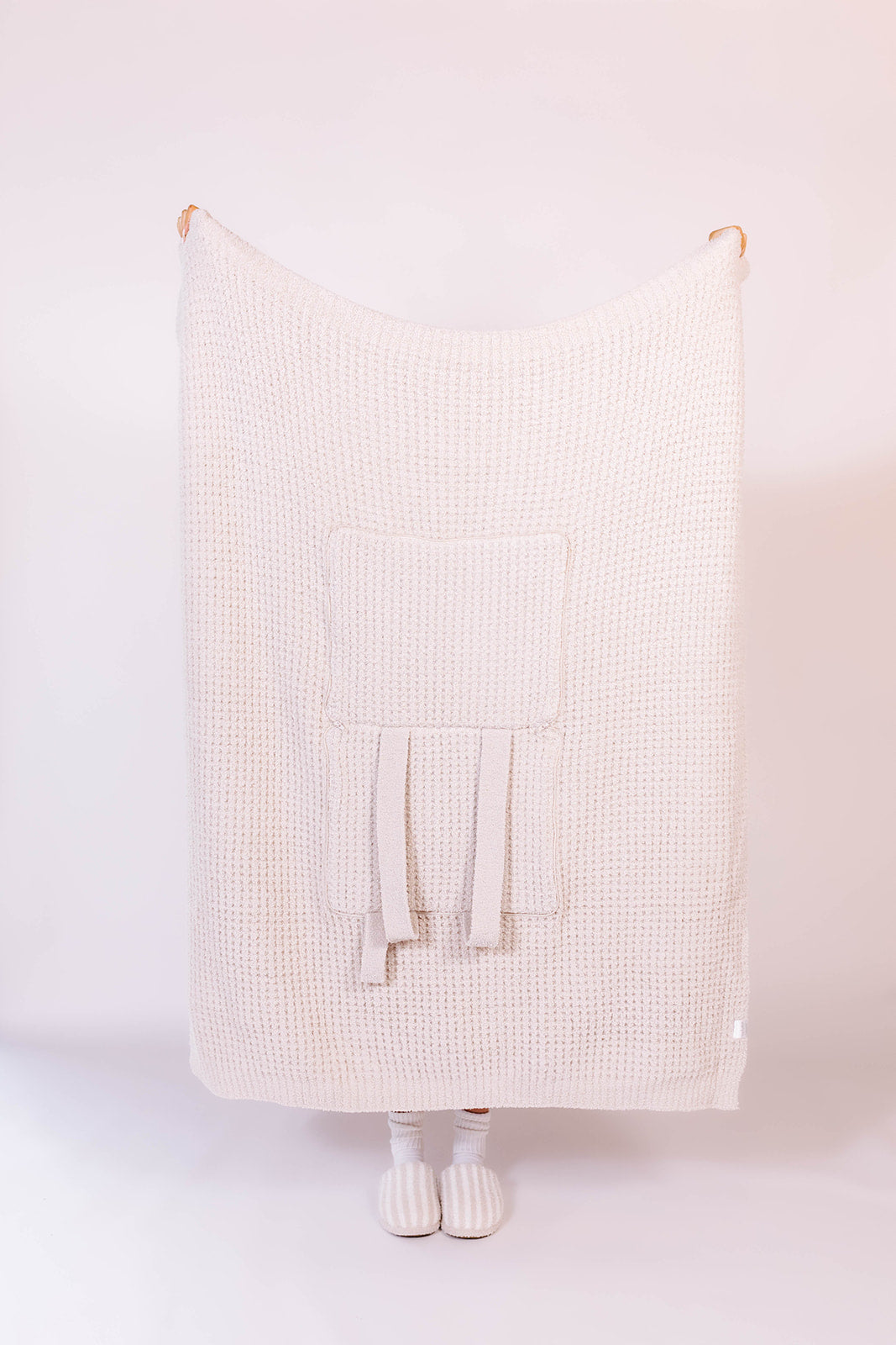 holding up the front side of the quillow