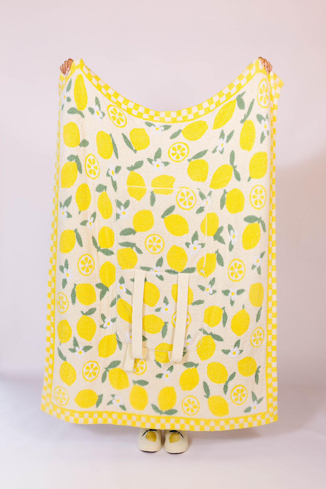 holding the quillow up to show the front side