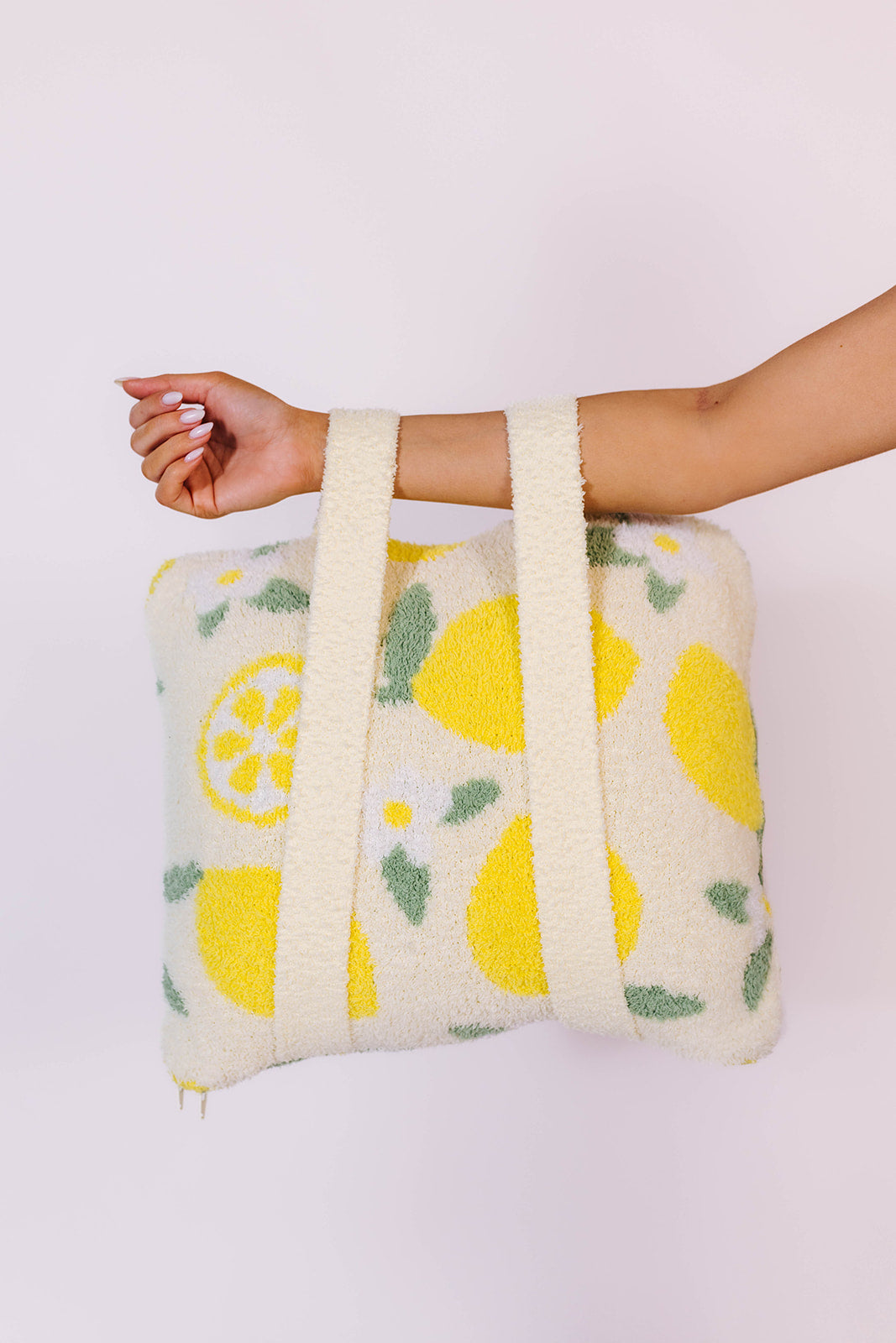 holding the quillow by the backpack straps