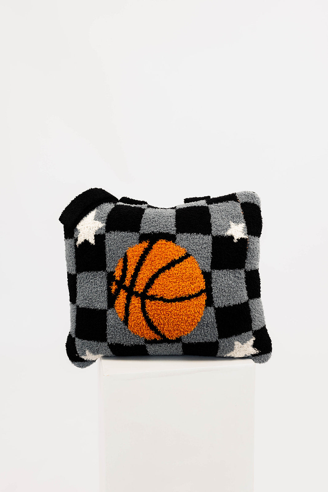 Checkered quillow with a basketball design on a white background