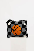 Checkered quillow with a basketball design on a white background