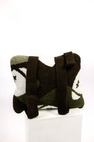 Decorative pillow with camo pattern and football designs on a white background