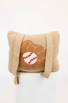 Beige quillow with a baseball design on a white background