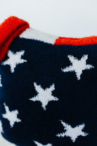 Navy blue fabric with white stars and red and white border