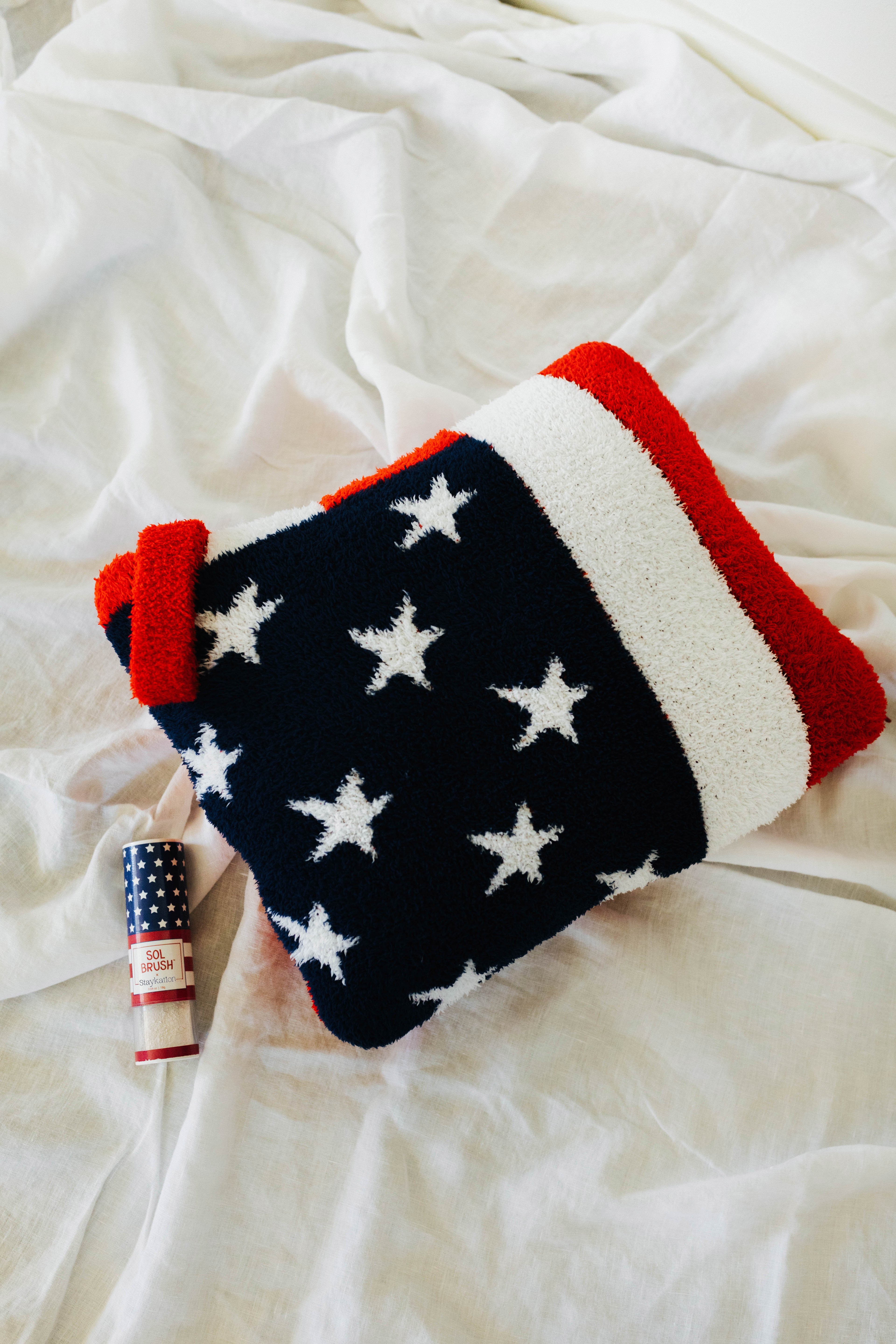 American flag quillow folded showcasign the sol brush too