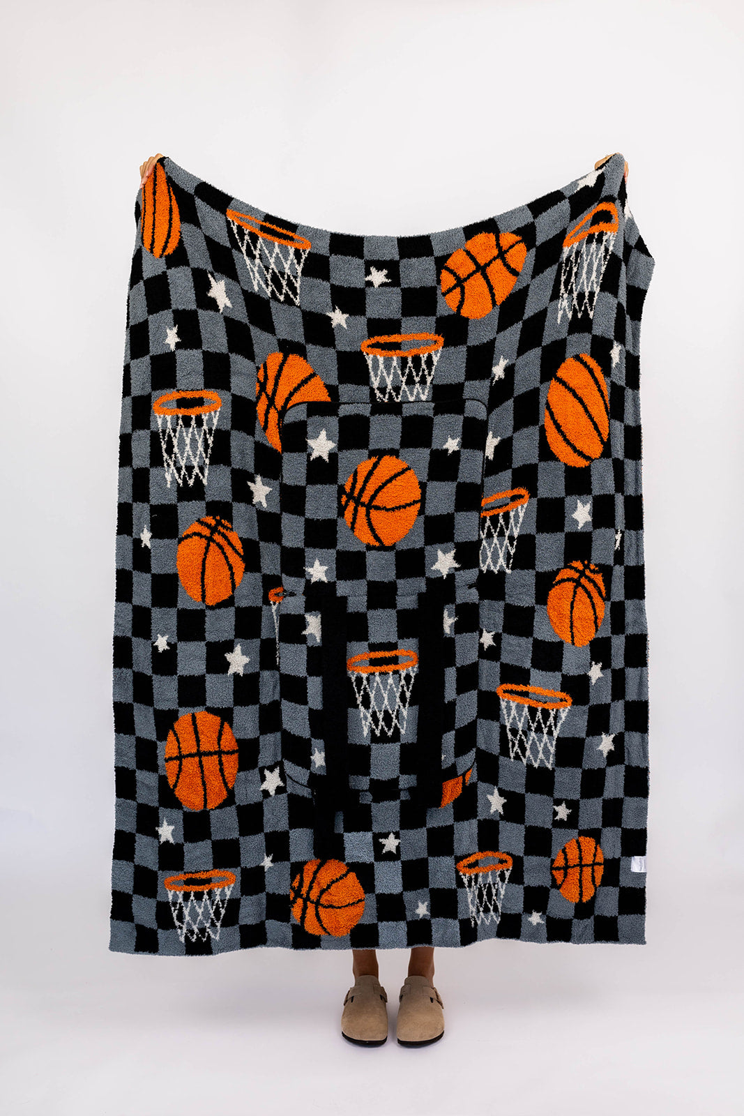 Basketball-themed blanket with checkered pattern on a white background