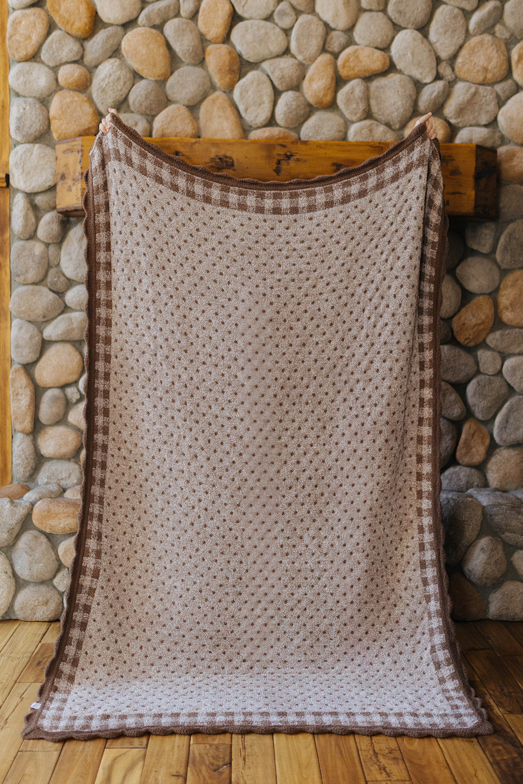 Reverse of the gingham blanket with small polka dots and a gingham border.