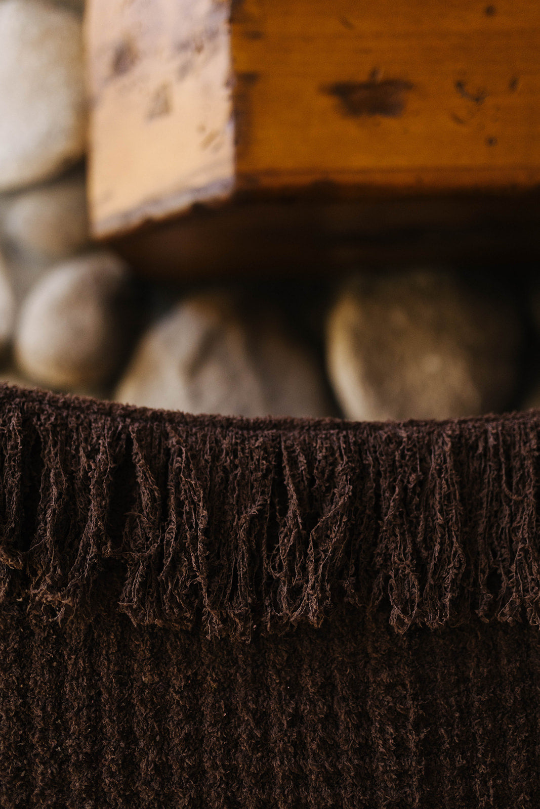 Close view of the brown waffle blanket fringe.