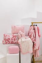 mixture of different pink items some on pillars and some hanging